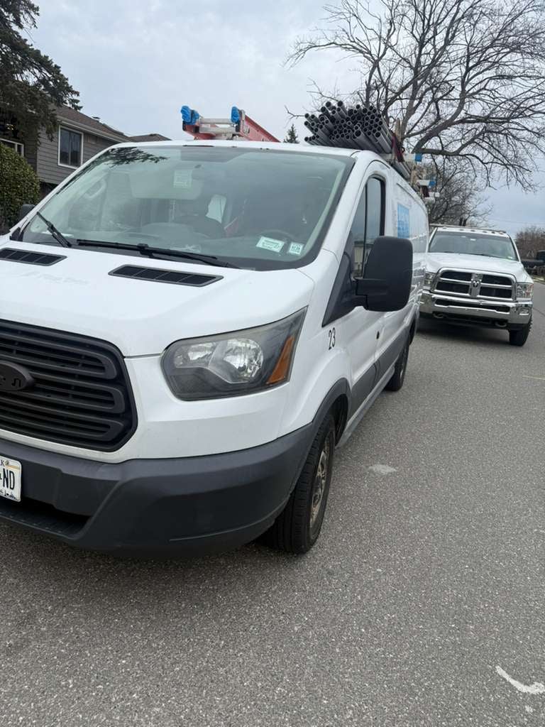 JG Towing Ford Transit van and Ram wrecker staged in Kew Gardens, Queens.
